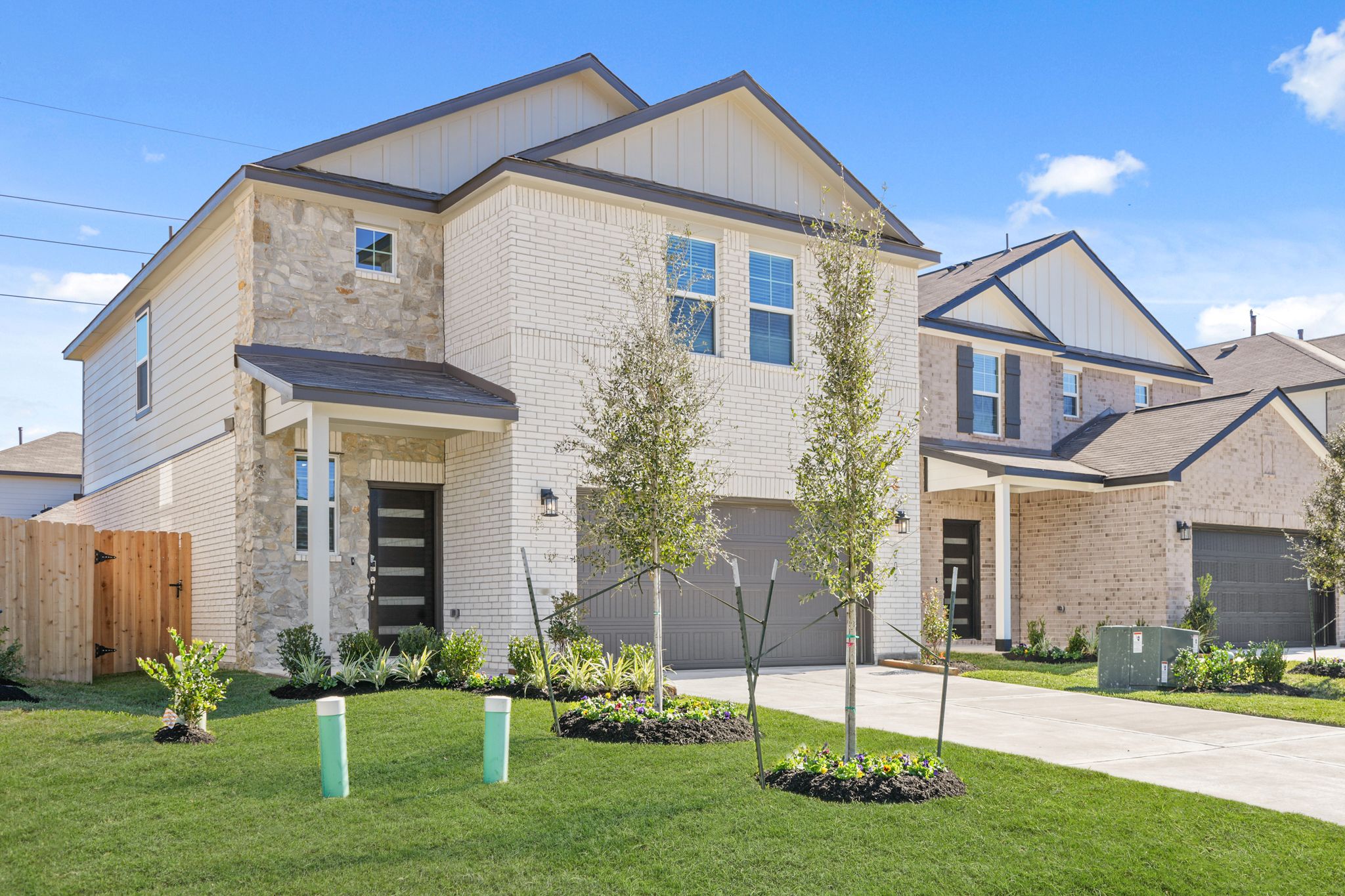 A house with a fence and trees.