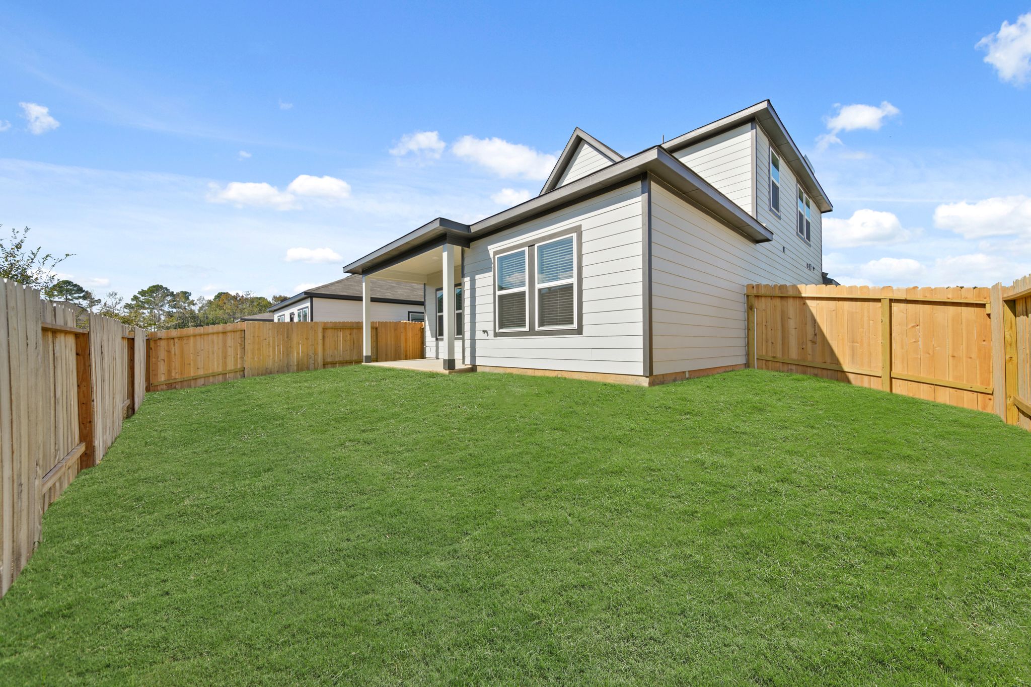 A house with a fence around it.