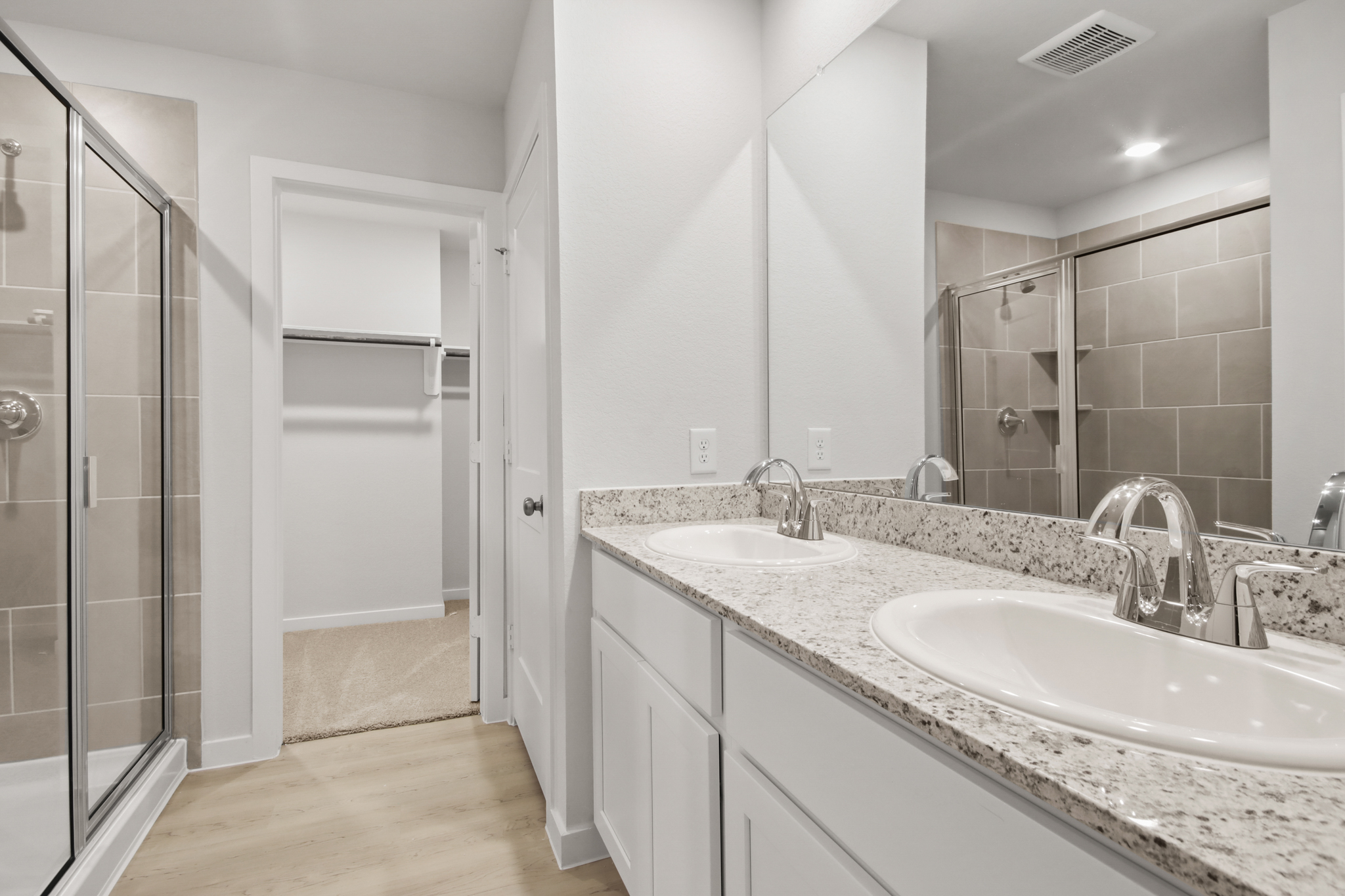 A bathroom with a glass shower.