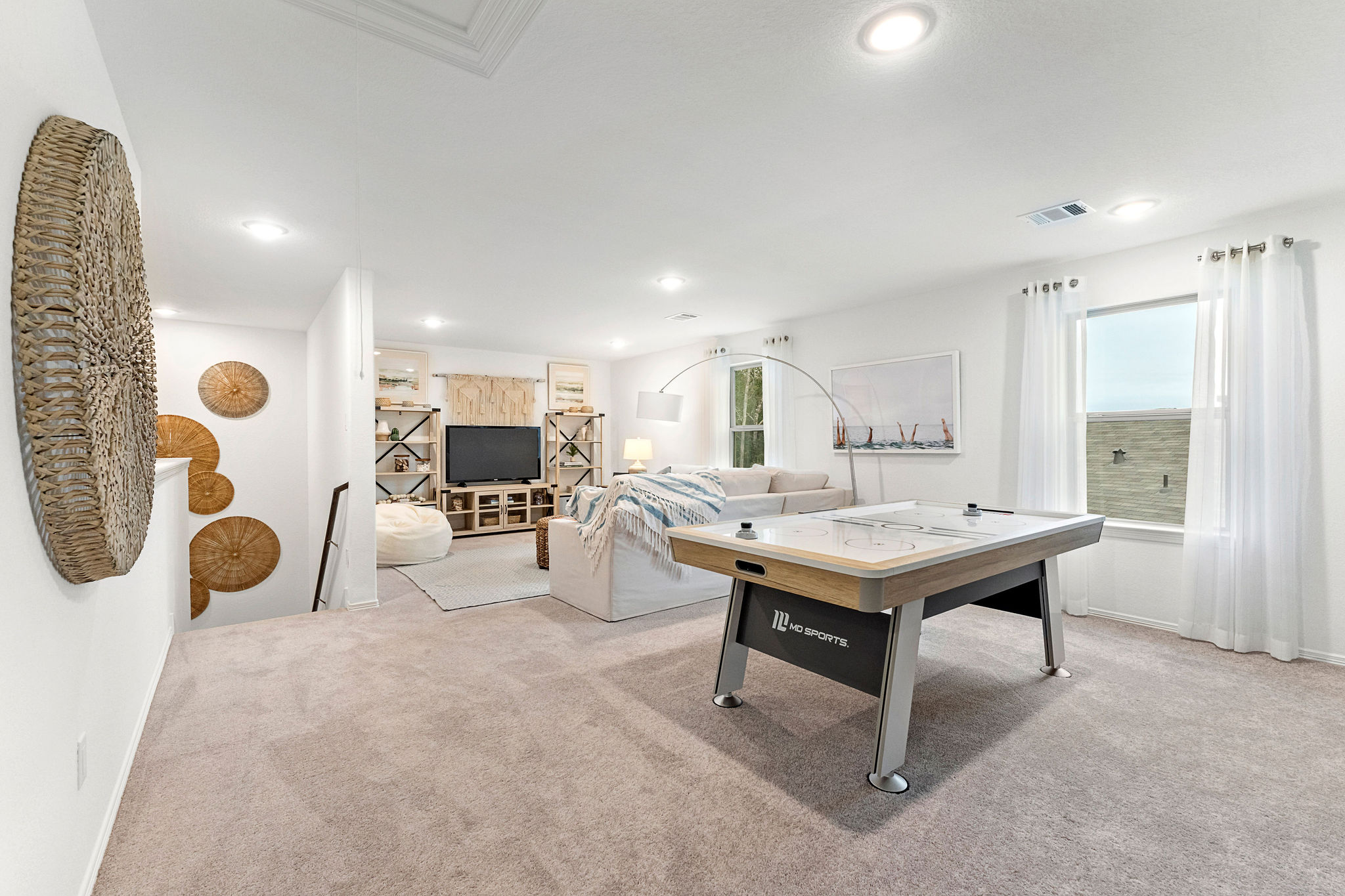 A room with a bed and a desk.