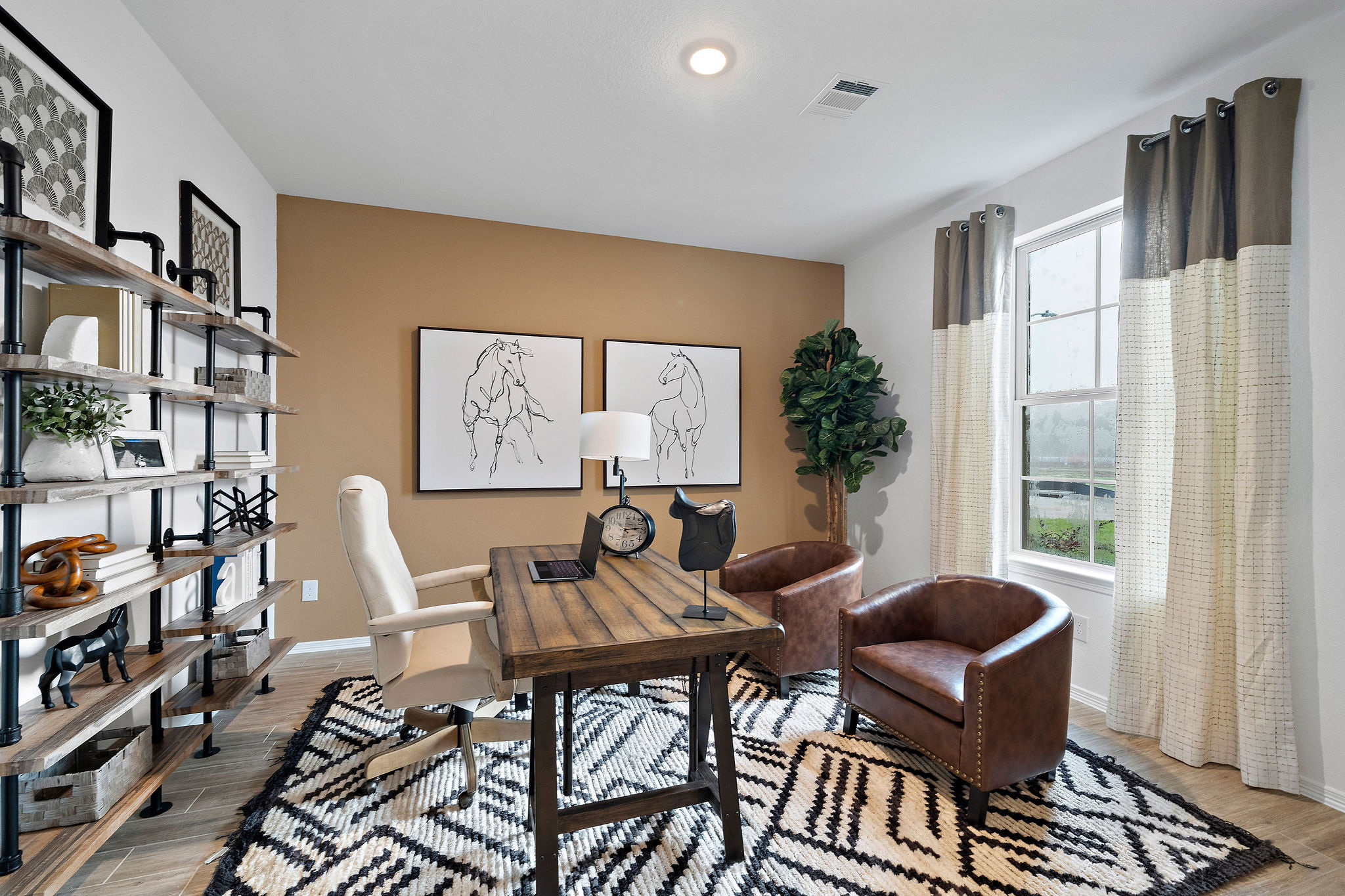 A room with a table and chairs.