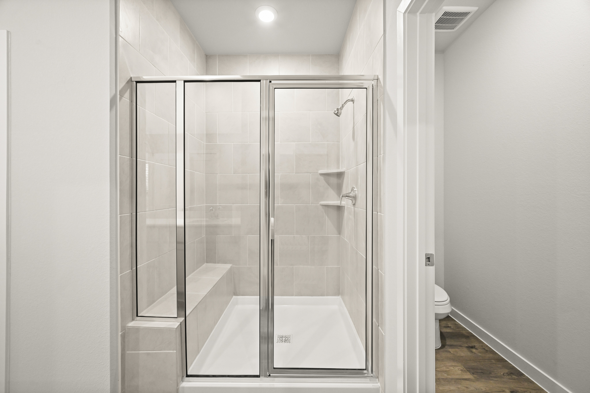 A bathroom with a glass shower.