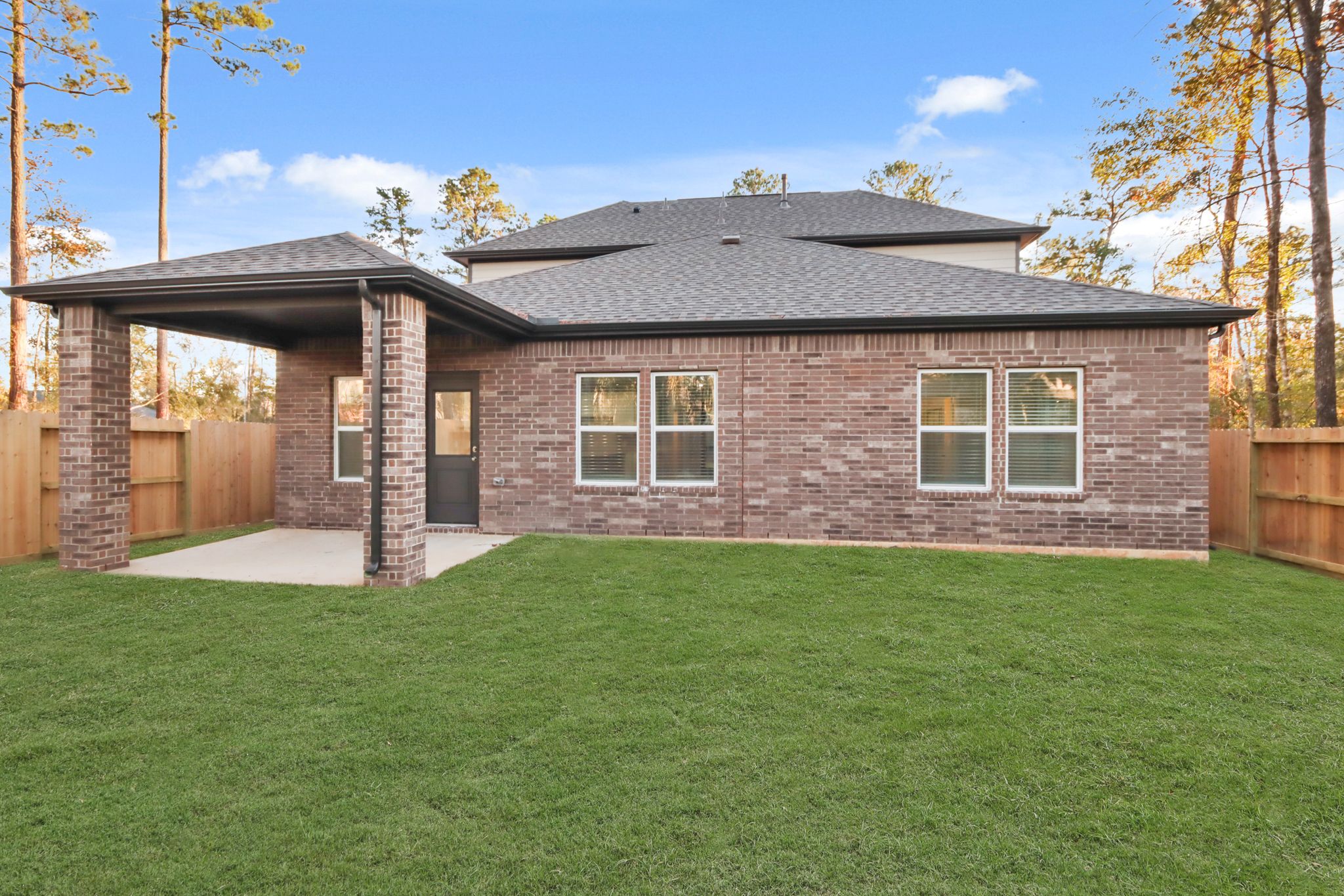 A house with a grass yard.