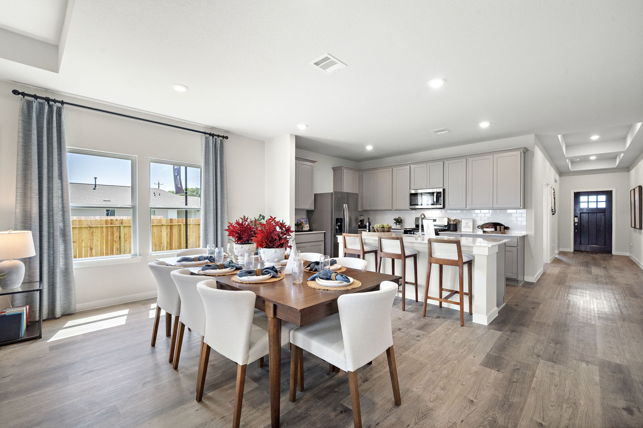 A large kitchen with a dining table.