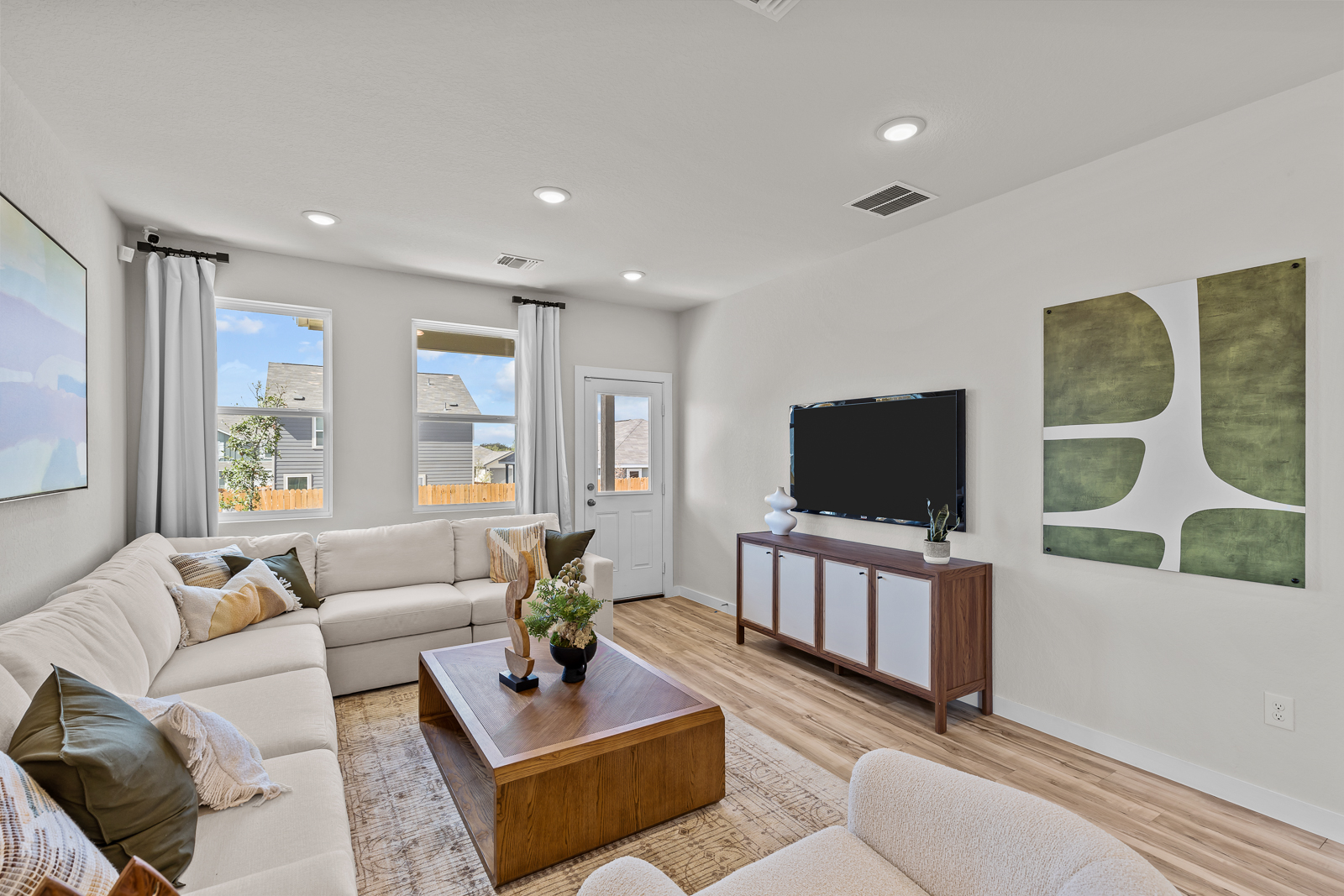 A living room with a tv and couches.