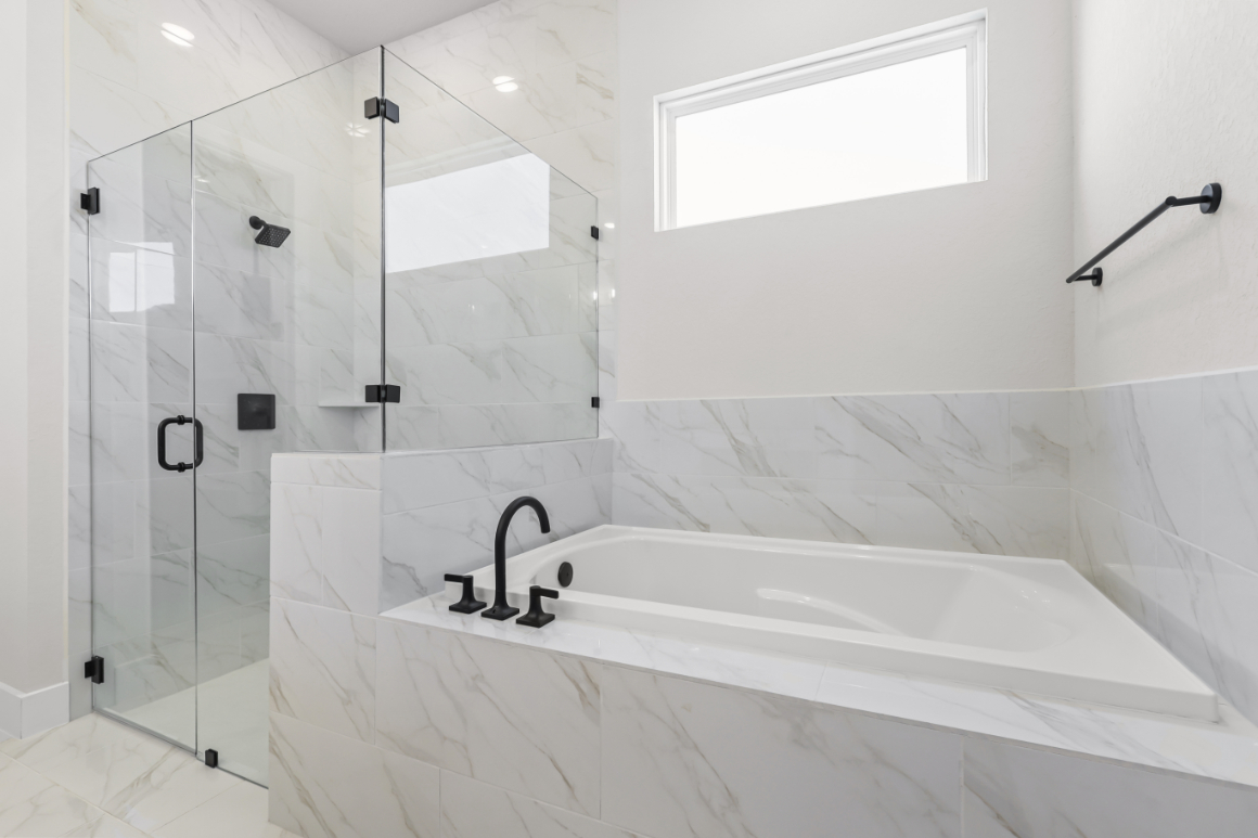 A bathtub in a bathroom.