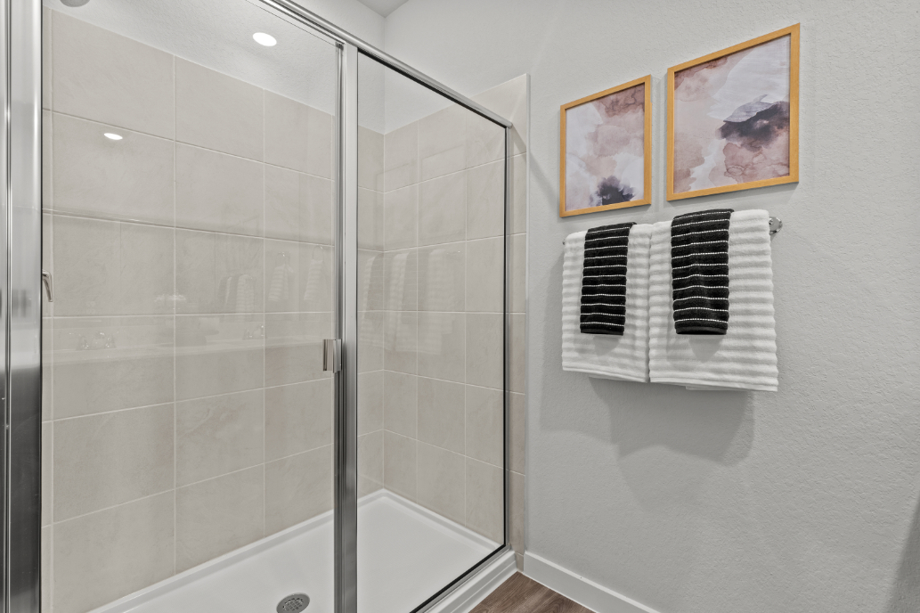 A bathroom with a glass shower.