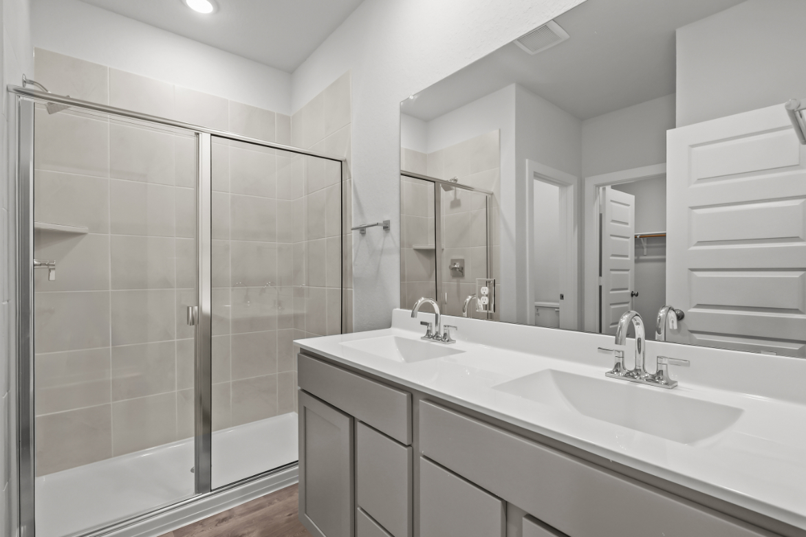 A bathroom with a glass shower.