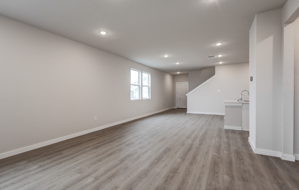 A room with a wood floor and a wood floor.