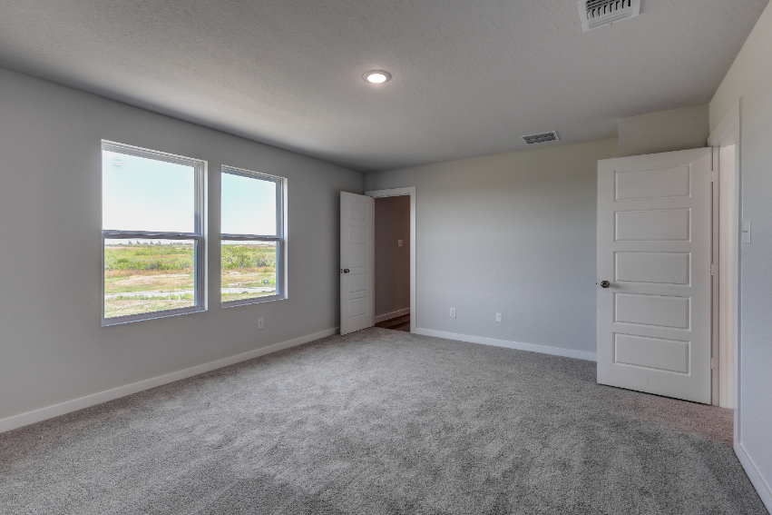 A room with white walls and windows.