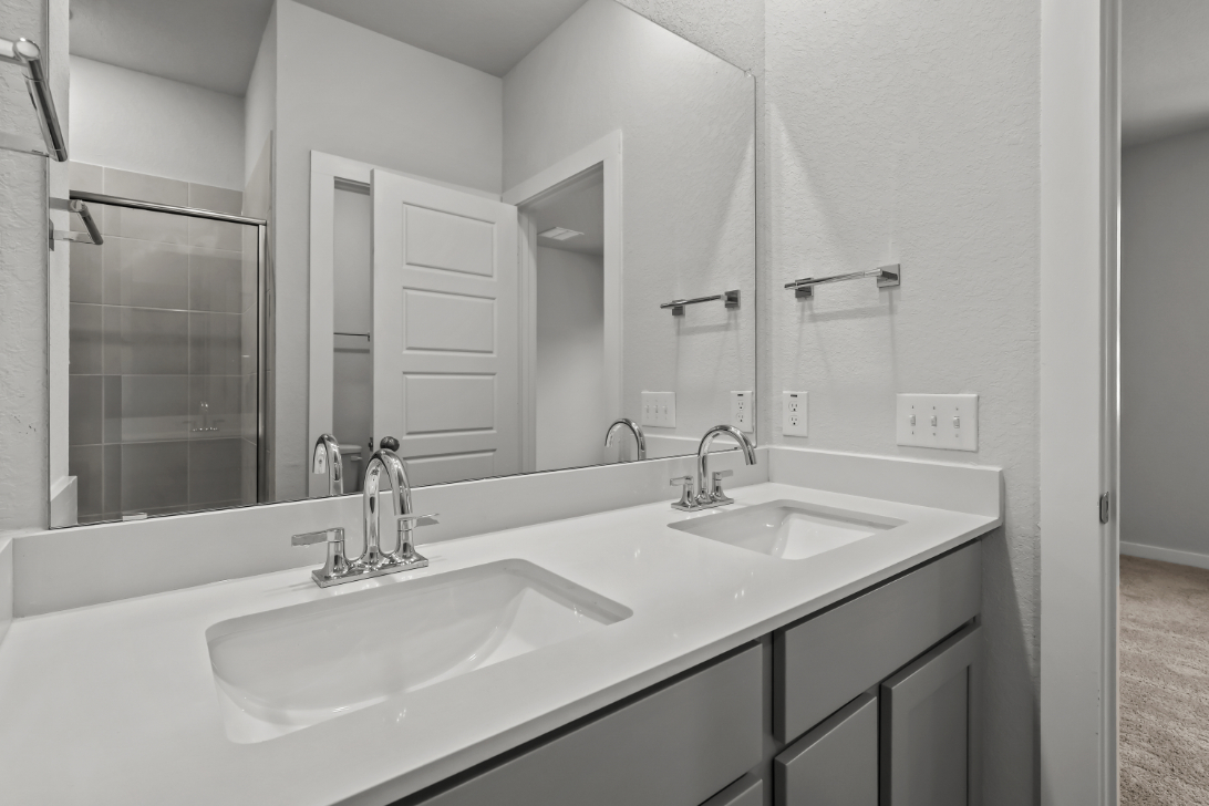 A bathroom with two sinks.