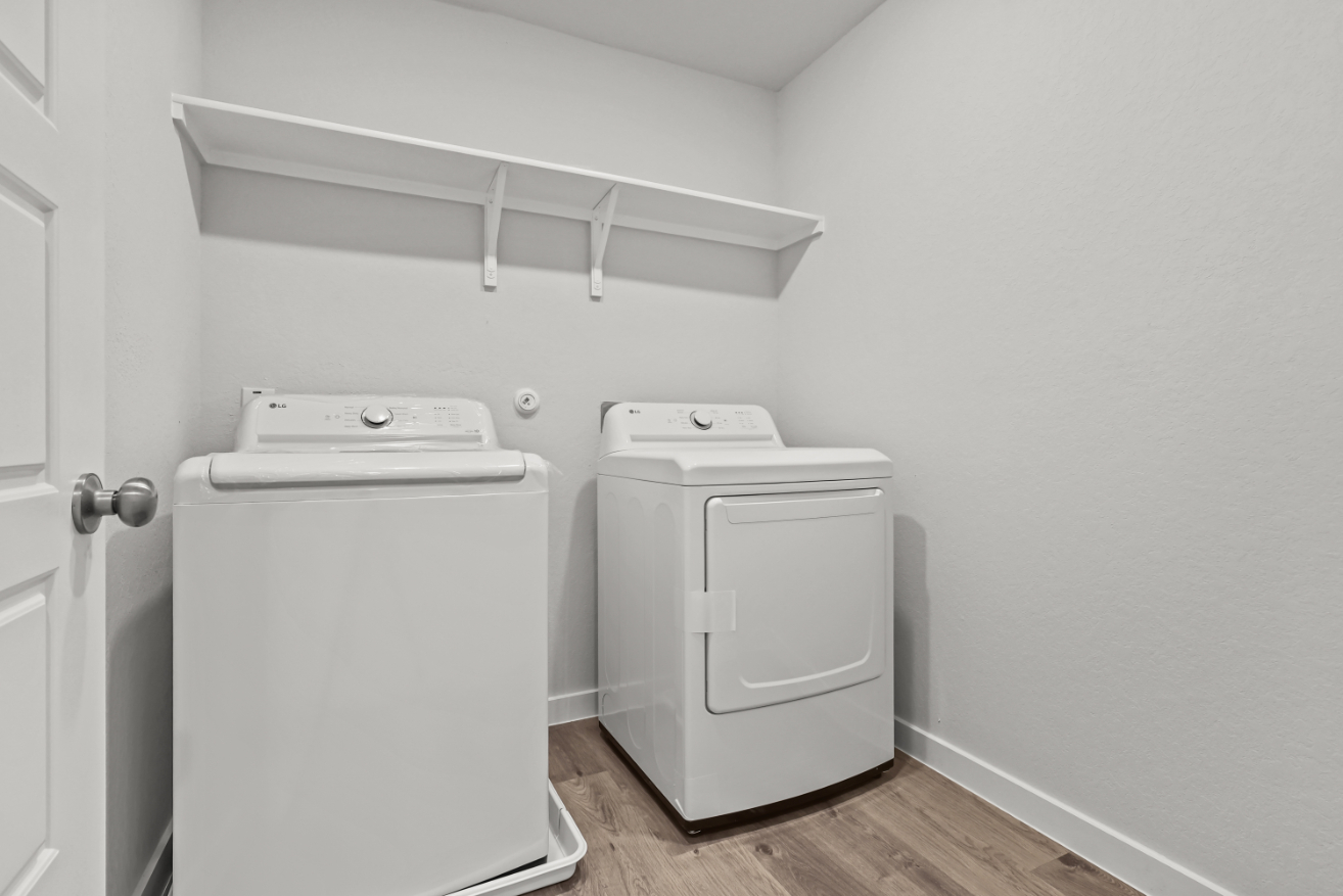 A white washing machine in a room.