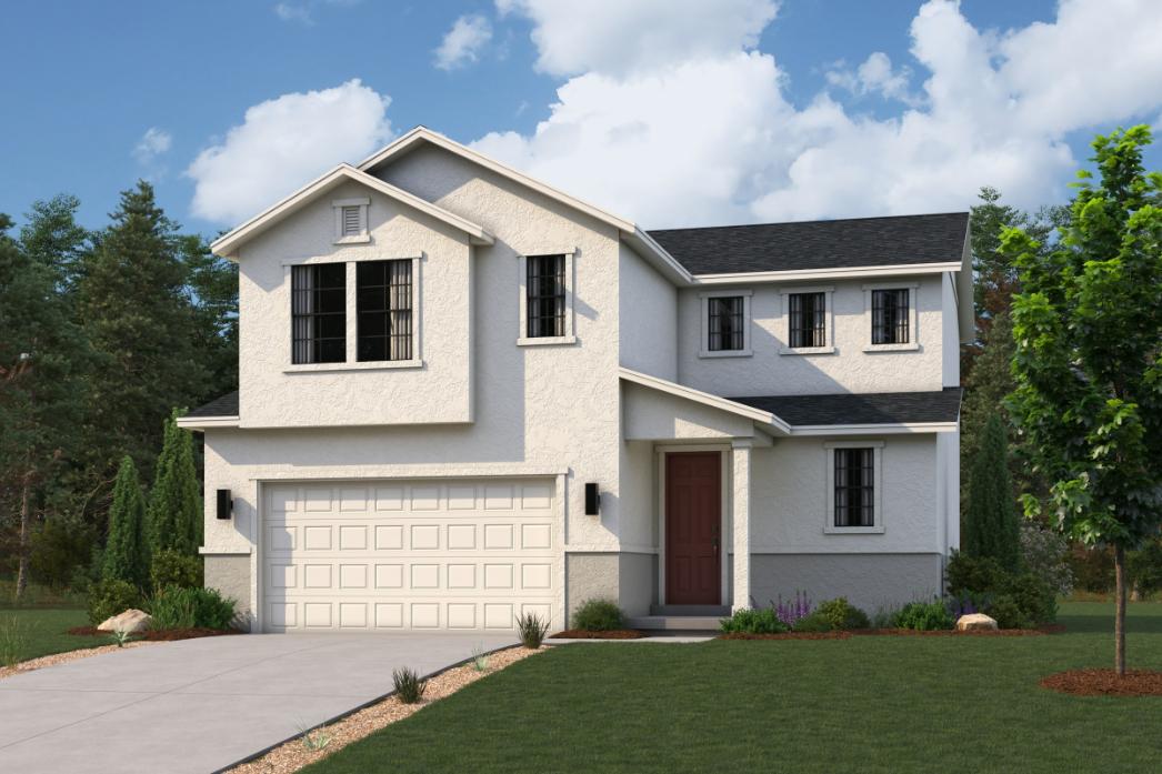 A white house with a driveway.