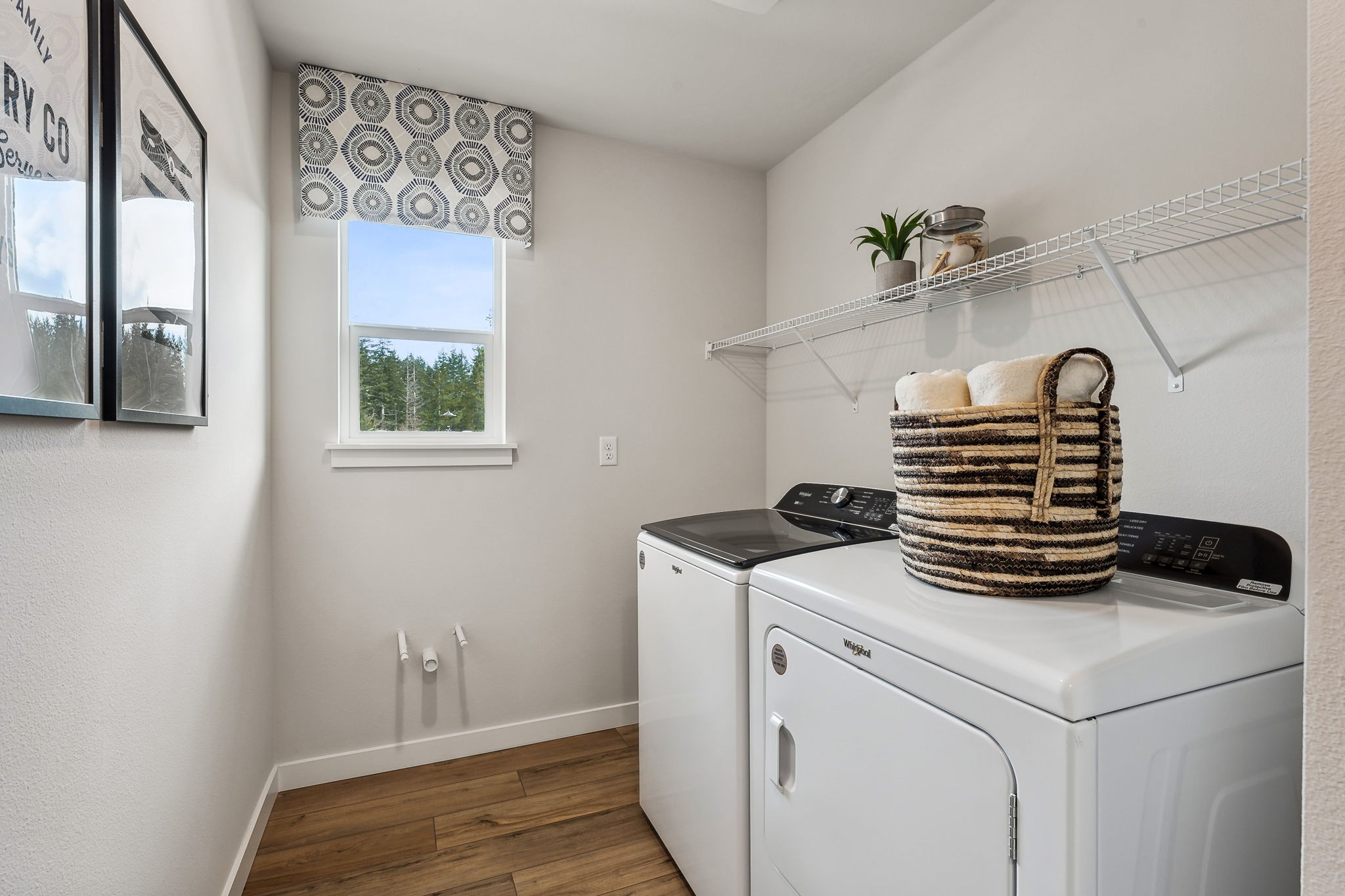 A kitchen with a basket on the stove.
