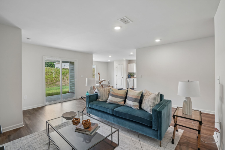 A living room with a blue couch.