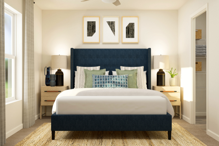 A bedroom with a bed and a desk.