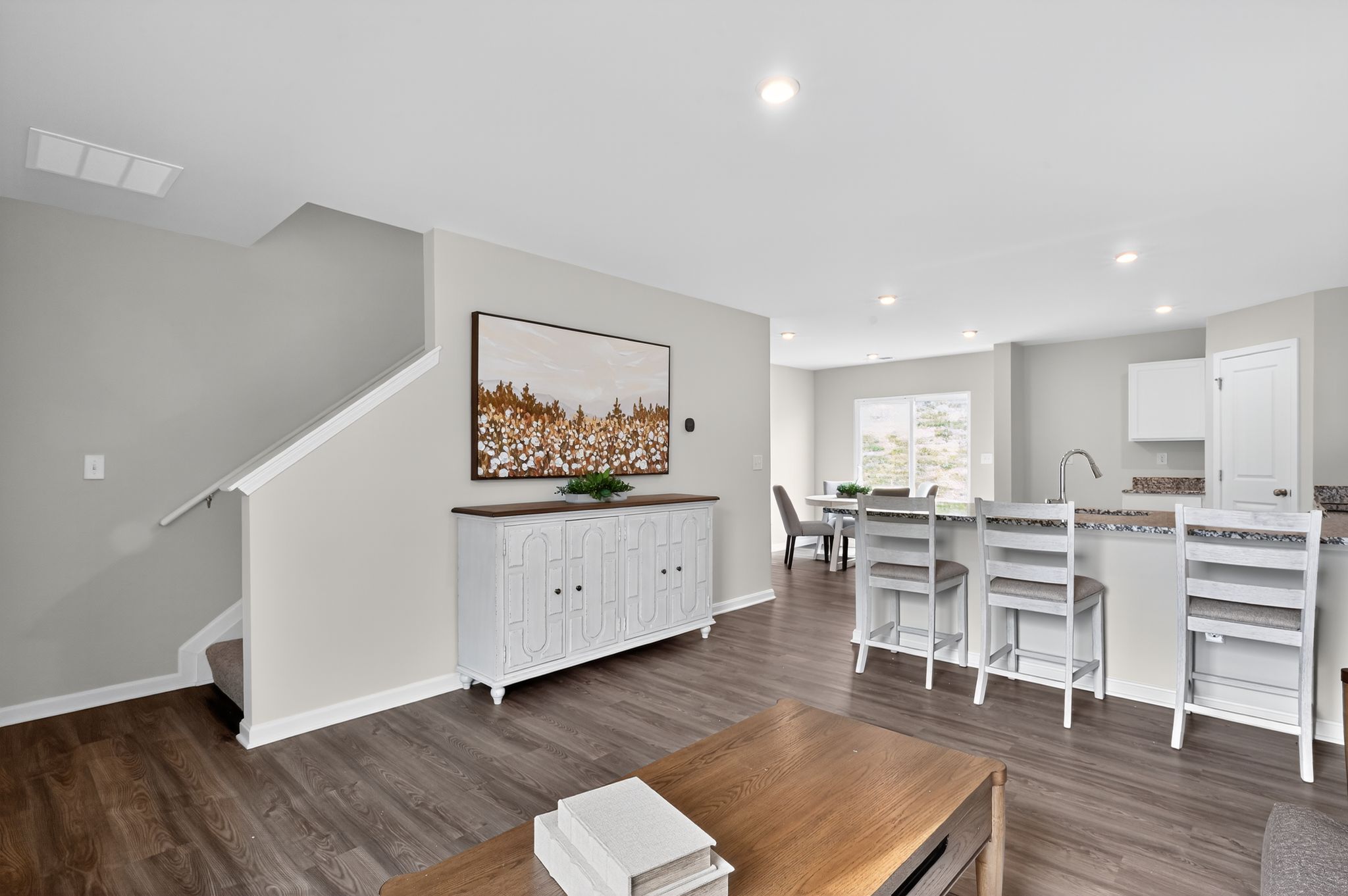 A room with a table and chairs.